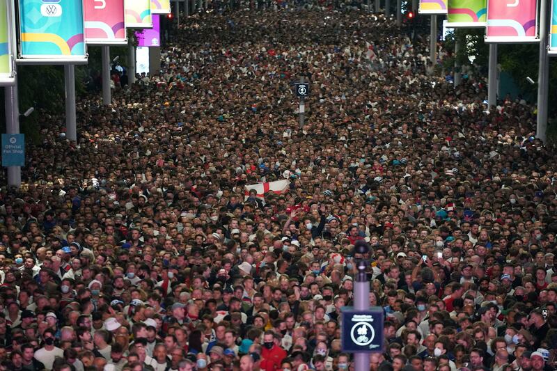 Fans celebrate outside Wembley Stadium after England beat Denmark 2-1 in extra-time.