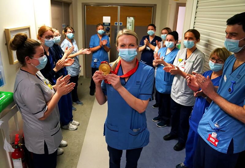 Olympic gold medal winning curler Vicky Wright returned to her day job as a nurse on Tuesday. On her arrival she was clapped on to the ward by colleagues at Forth Valley Hospital in Larbert, Scotland. PA