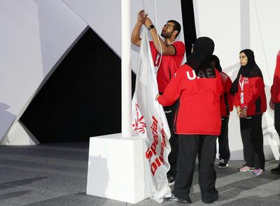 Abu Dhabi, United Arab Emirates - March 22nd, 2018: The flag is brought down and passed over at the Closing Ceremony of the Special Olympics Regional Games. Thursday, March 22nd, 2018. ADNEC, Abu Dhabi. Chris Whiteoak / The National