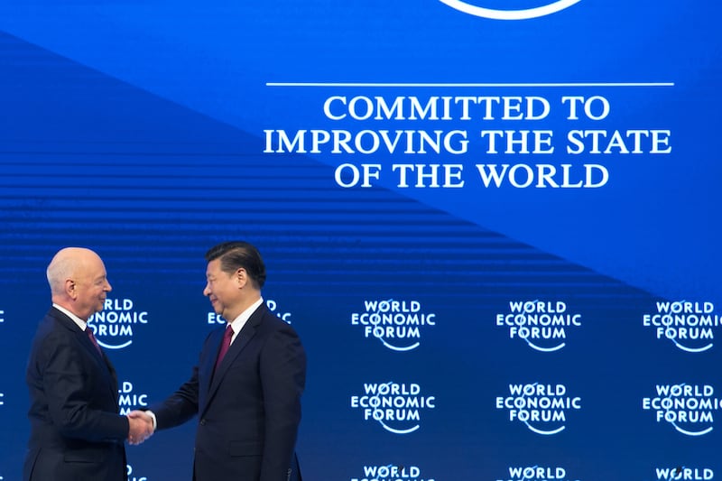 Chinese president Xi Jinping, left, WEF founder and executive chairman greet each other at the World Economic Forum annual meeting.Ciaran McCrickard / World Economic Forum
