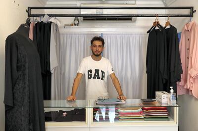 RAK , UNITED ARAB EMIRATES , May 13 – 2020 :-  Asim Atay from Afghanistan working at the Al Farasha Cloaks & Shaila garment shop at the Kuwaiti shopping street in Ras Al Khaimah. (Pawan Singh / The National) For News/Online. Story by Ruba Haza