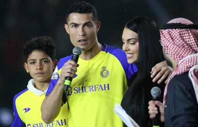 Portuguese footballer Cristiano Ronaldo with Georgina Rodriguez and his son Cristiano Ronaldo Jr at the Mrsool Park Stadium in Riyadh. AFP