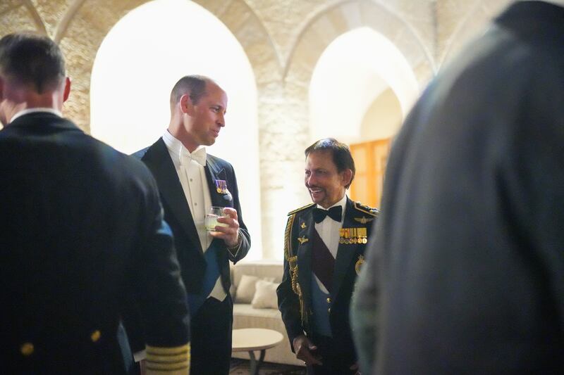 Prince William speaks with guests in Amman. PA