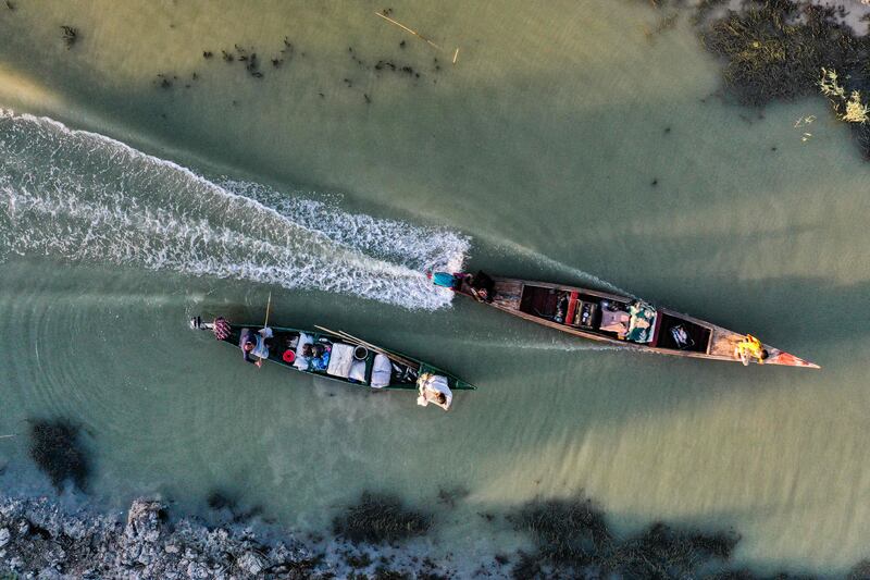 An aerial view of fishermen's boats in ahwar marshland at Chibayish. Already much-reduced through draining for cultivation, drought now threatens the marshes and way of life of the Marsh Arabs.