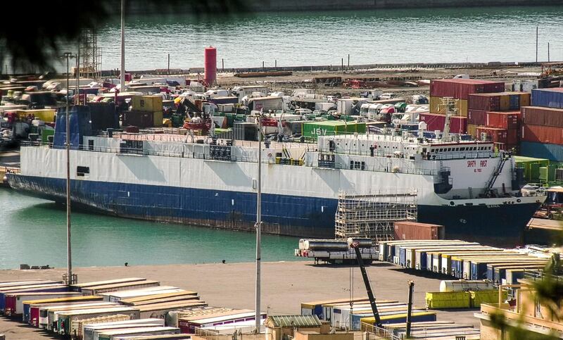 This image made from video shows a Lebanese-flagged cargo ship Bana docked in the port in Genoa, northern Italy, Thursday, Feb. 20, 2020.  Authorities in northern Italy arrested the captain of a Lebanese-flagged cargo ship on suspicion of international arms trafficking Wednesday while they investigate if the vessel transported tanks, rockets and other weapons from Turkey to Libya. (AP Photo/str)