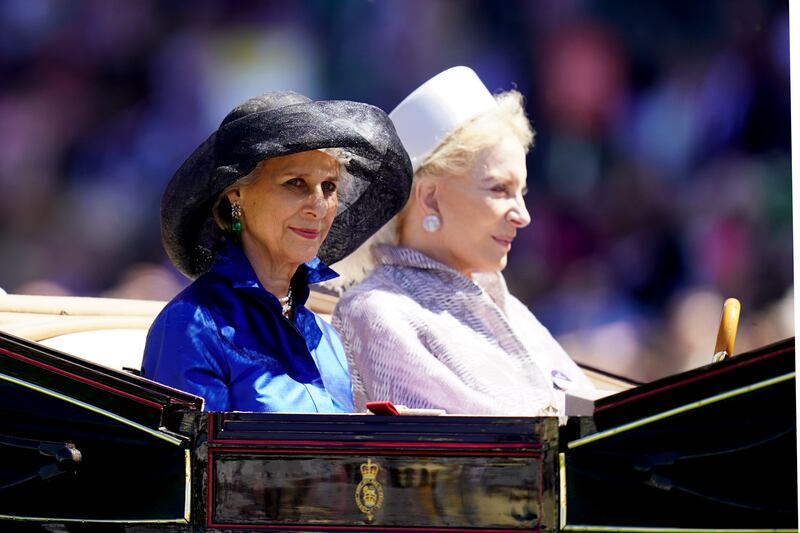 The Duchess of Gloucester, left, and Princess Michael of Kent arriving by carriage during the royal procession. PA