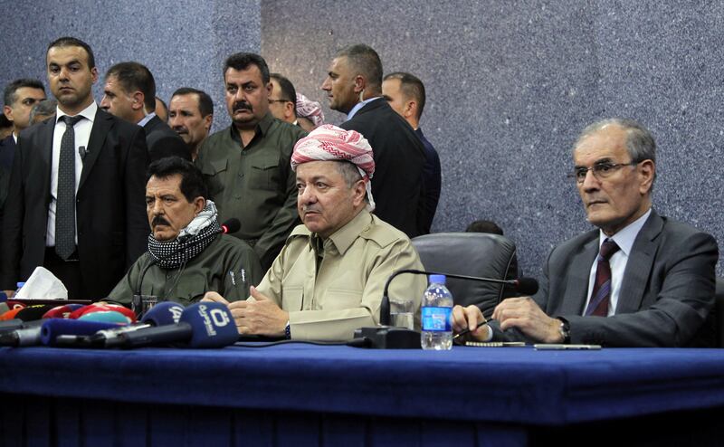 Iraq's Kurdistan region president Massud Barzani (C) attends an assembly with Kirkuk provincial Governor Najim al-Din Karim (R) and Kosrat Rasoul Ali (L), the first Deputy for the Secretary General of the Patriotic Union of Kurdistan (PUK) party, and other representatives of the Peshmerga and Arab, Kurdish, and Iraqi Turkmen tribal leaders in the northern Iraqi city of Kirkuk on September 12, 2017. 
Iraq's parliament's voted on September 12, 2017 against plans by Kurdish leaders to hold an independence referendum just two weeks before it was to be held, echoing regional criticism of the poll. 
Barzani, who is organising the referendum, however said from the disputed city of Kirkuk that the poll would be held because "all other bids" to secure Kurdish rights "have failed". / AFP PHOTO / Marwan IBRAHIM