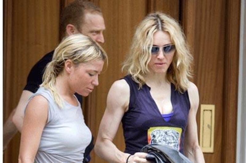 Gym slip-ups: the singer Madonna (right) with her former personal trainer Tracy Anderson after a workout.