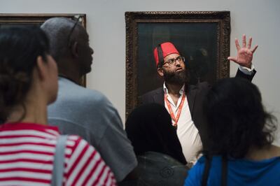 AbdulMalik Tailor leads a tour of the Tate Britain gallery in London, pre-pandemic. 