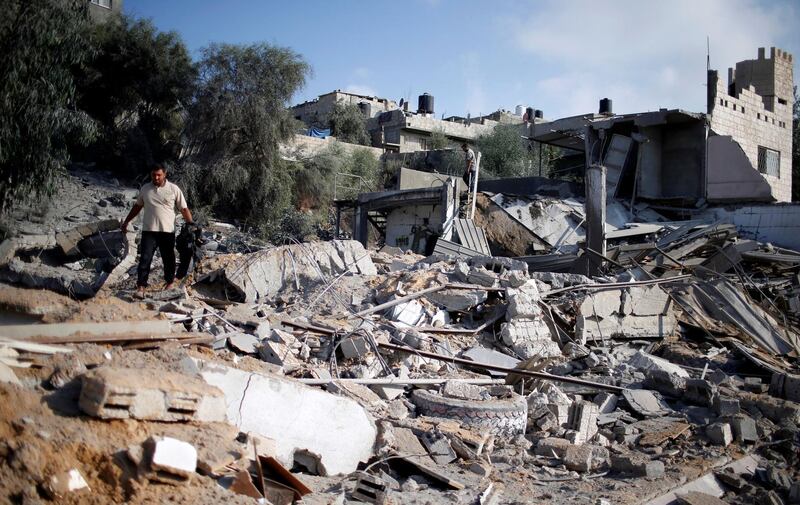 A man inspects a Hamas site that was hit in an Israeli air strike in Al-Mughraqa. Reuters