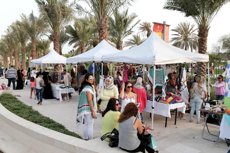 People gather at the Ripe Market at Mushrif Central Park in Abu Dhabi. With food trucks, arts and crafts stalls, vendors, live music and children’s activities, there really is something for everyone at the market. Christopher Pike / The National