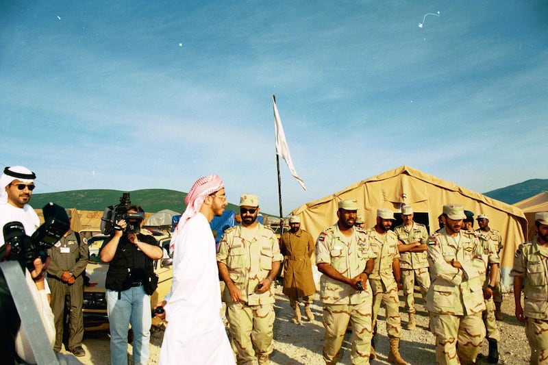 A young Sheikh Abdullah bin Zayed accompanied by a TV crew tours the camp. Also pictured centre right is Obaid Al Ketbi. Courtesy: Maj Gen Obaid Al Ketbi