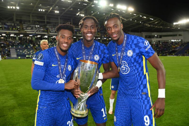 Chelsea's Callum Hudson-Odoi, Trevoh Chalobah and Tammy Abraham celebrate with the Uefa Super Cup after beating Villarreal at Windsor Park in Belfast on August 11.