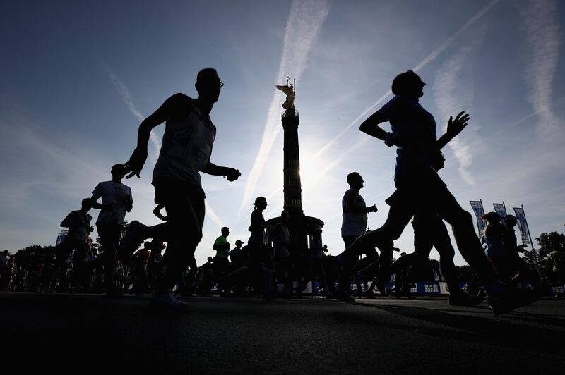 Athletes race past the Berlin Victory Column during the Berlin Marathon, Germany.  Getty