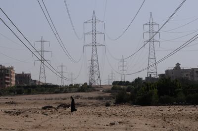 Cairo, Egypt-- October 27,2010-- Power lines bring electricity from the High Dam to a community in the Sixth of October.  (Dana Smillie for The National)