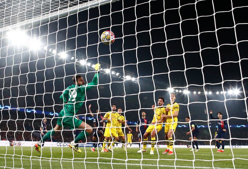 Mats Hummels scores a header past PSG goalkeeper Gianluigi Donnarumma to give Dortmund a 2-0 aggregate leas. Reuters