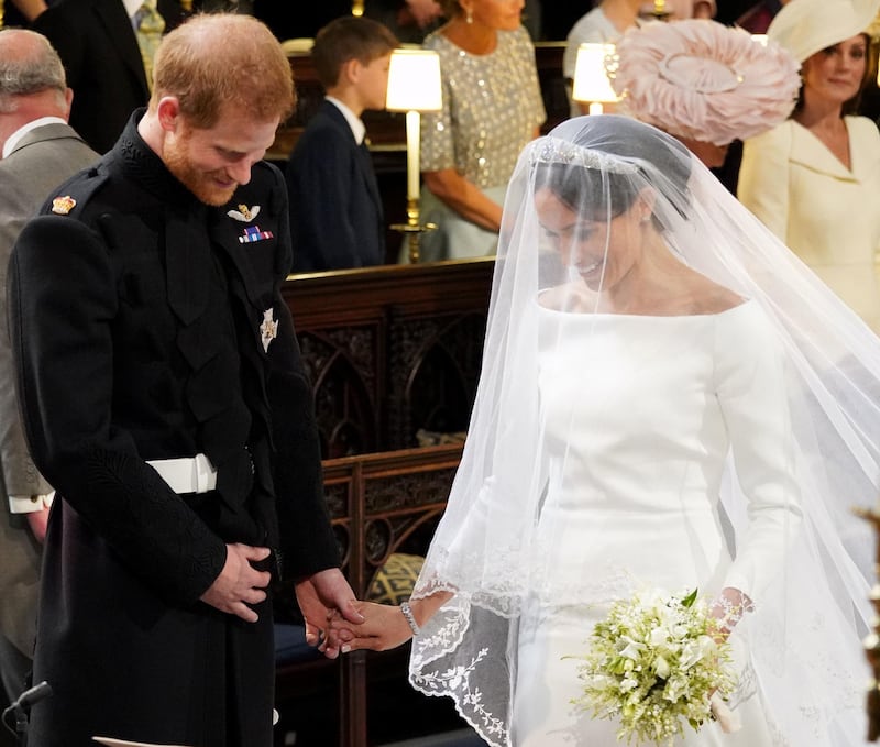 WINDSOR, UNITED KINGDOM - MAY 19:  Prince Harry and Meghan Markle stand at the altar during their wedding in St George's Chapel at Windsor Castle on May 19, 2018 in Windsor, England. (Photo by Jonathan Brady - WPA Pool/Getty Images)