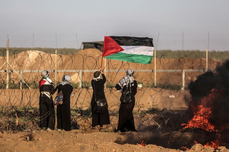 epa06941592 Palestinian female protesters take part during clashes with Israeli troops near the border with Israel in the east of Gaza City, 10 August 2018. Two Palestinians protesters were shot dead and more than 240 other got injured during the clashes after Friday protests between Israeli troops and Palestinians protesters near the border eastern Gaza Strip. Protesters plan to call for the rights of Palestinian refugees across the Middle East to return to their homes that they fled in the war surrounding the 1948 creation of Israel.  EPA/HAITHAM IMAD