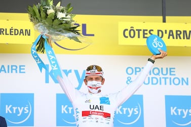 UAE Team Emirates rider Tadej Pogacar on the podium wearing the white jersey for best young rider Reuters