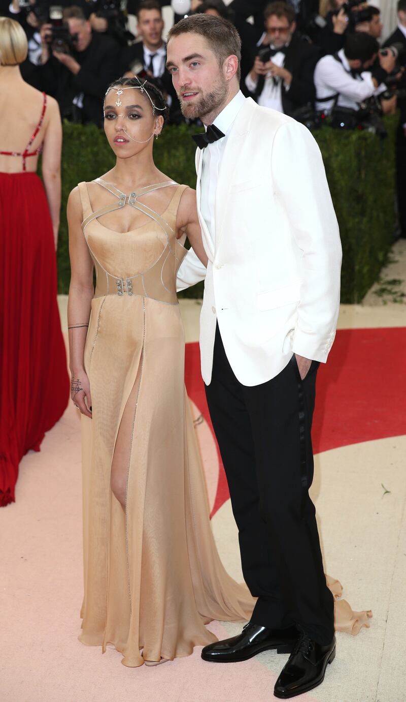 Taking it up a notch in a white tux jacket, Robert Pattinson arrives with FKA Twigs for the 2016 Costume Institute Benefit at The Metropolitan Museum of Art on May, 2 2016. EPA