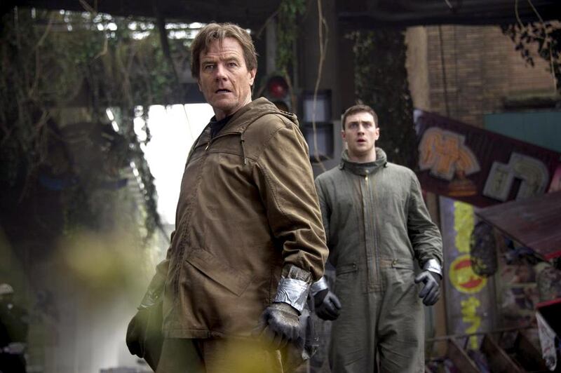 Bryan Cranston and Aaron Taylor-Johnson in a scene from Godzilla. Courtesy Warner Bros
