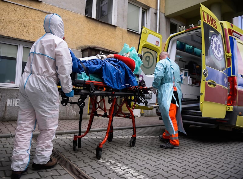 Paramedics arrive with a patient suffering from Covid-19 at the hospital in Bochnia, Poland. AP Photo