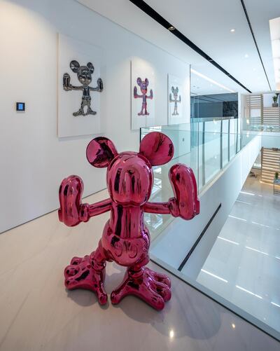 Mickey Mouse pop art pieces by Fidia Falaschetti, that seem to have been inspired by Jeff Koons, inject personality into the property. Courtesy Luxhabitat Sotheby's International Realty