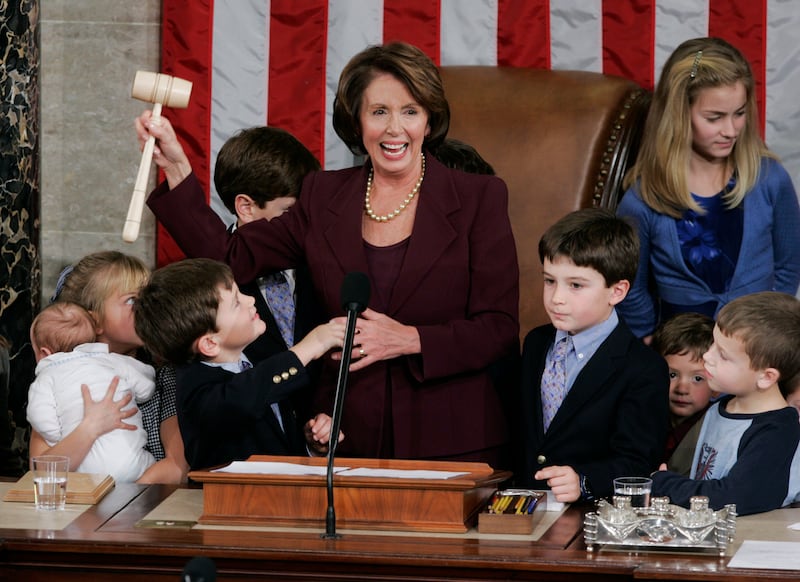 Ms Pelosi surrounded by children and grandchildren in 2007. AP