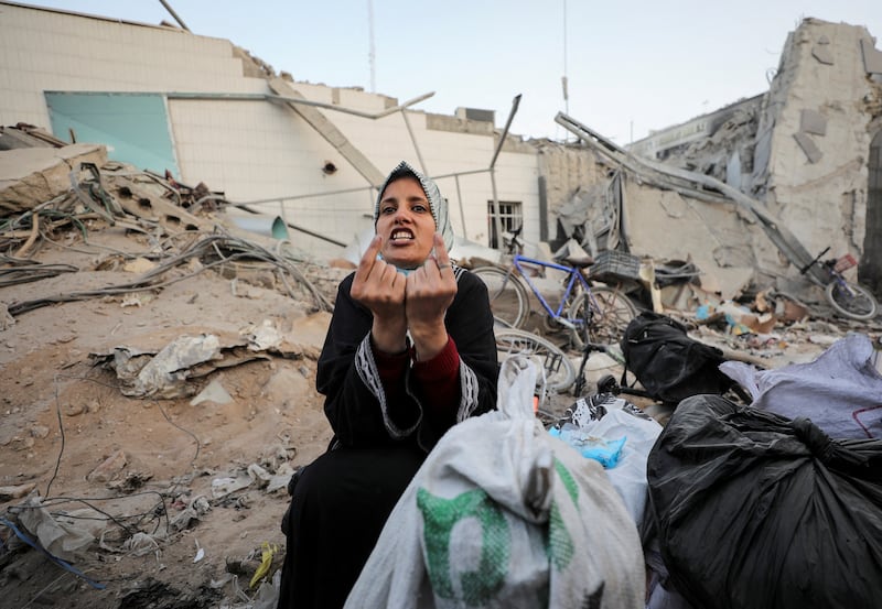 A woman at the damaged Al Shifa Hospital, on April 1, after Israeli forces withdrew from the medical complex following a two-week siege. Reuters