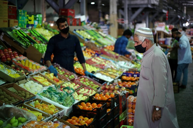 A Bahraini man wears a protective face mask following the outbreak of the coronavirus disease, as he shops at a vegetables market. Reuters