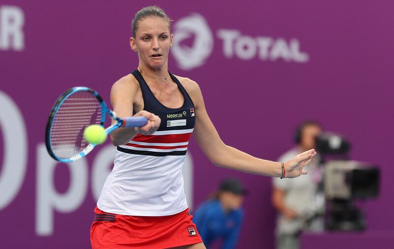 Karolina Pliskova of the Czech Republic returns the ball to Catherine Bellis of the US as they compete in their singles match during the third round of the Qatar Open tennis competition in Doha on February 15, 2018. / AFP PHOTO / KARIM JAAFAR