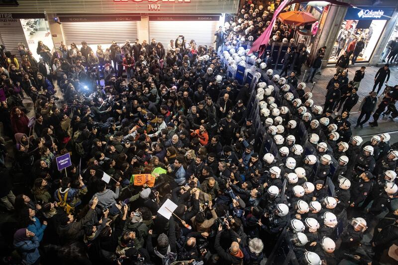 Demonstrators scuffle with riot police during a protest against femicide and violence against women in Istanbul, Turkey. Getty Images