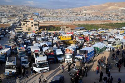 Syrian refugees gather as they prepare to leave Lebanon's Arsal town, before their journey to their homes in Syria, in Bekaa valley, Lebanon, October 26, 2022. EPA