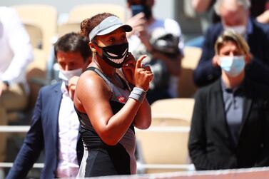 PARIS, FRANCE - MAY 30: Naomi Osaka of Japan looks on before being interviewed on court after winning her First Round match against Patricia Maria Tig of Romania during Day One of the 2021 French Open at Roland Garros on May 30, 2021 in Paris, France. (Photo by Julian Finney/Getty Images)