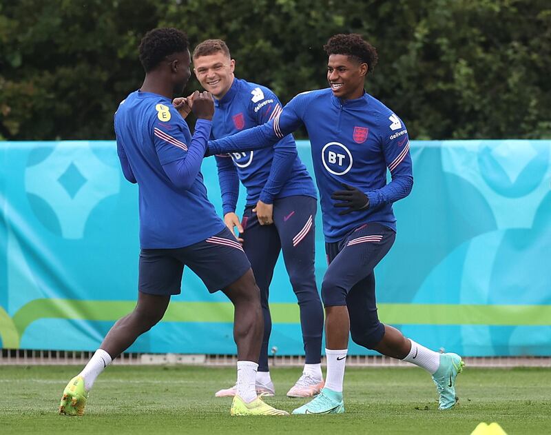 Left to right: Bukayo Saka, Kieran Trippier and Marcus Rashford. Reuters