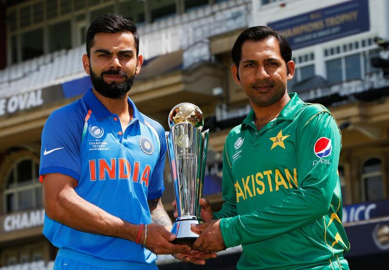 Britain Cricket - India &amp; Pakistan Nets - The Oval - June 17, 2017 Pakistan's Sarfraz Ahmed and India's Virat Kohli pose with the trophy Action Images via Reuters / Paul Childs Livepic EDITORIAL USE ONLY.