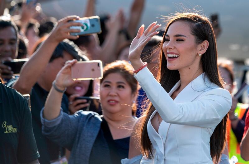 Miss Universe 2018 Catriona Gray of the Philippines waves as she arrives at the Manila International airport. AFP