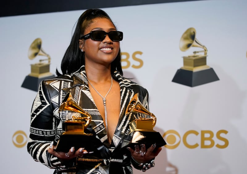 Jazmine Sullivan, winner of the awards for best R&B performance for 'Pick Up Your Feelings,' and best R&B album for 'Heaux Tales,' poses in the press room. AP