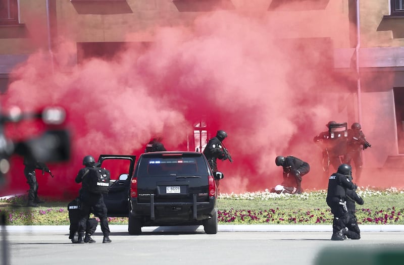 Police simulate a shooting incident during a presentation ahead of the graduation ceremony. Wam