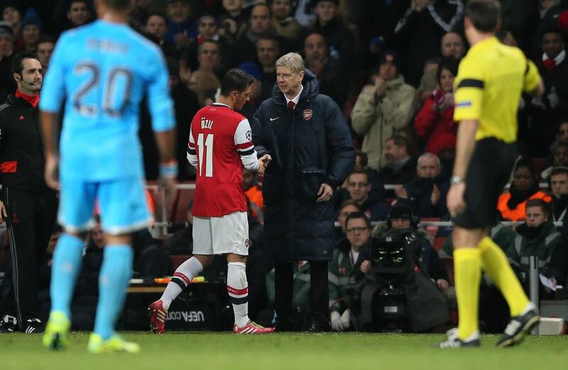 Arsene Wenger, centre right, wants the focus to stay on Arsenal's run of success and not his contract situation. Alastair Grant / AP Photo