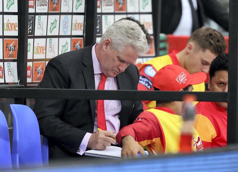 Dubai, United Arab Emirates - February 17, 2019: United coach Dean Jones makes notes during the game between Islamabad United and Quetta Gladiators in the Pakistan Super League. Sunday the 17th of February 2019 at The International Cricket Stadium, Dubai. Chris Whiteoak / The National