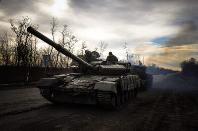 A Ukrainian tank rolls on a road near Bakhmut, in the Donetsk region, on November 30. AFP