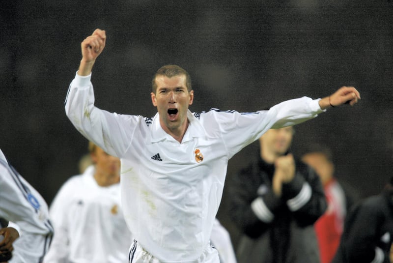GLASGOW - May 15:  Zinedine Zidane of Real Madrid celebrates winning the cup after the UEFA Champions League Final between Real Madrid and Bayer Leverkusen played at Hampden Park, in Glasgow, Scotland on May 15, 2002. Real Madrid won the match and cup 2-1. DIGITAL IMAGE. (Photo by Gary M. Prior/Getty Images)