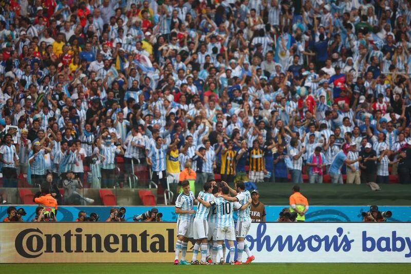 Marcos Rojo of Argentina celebrates scoring the winner on Wednesday in a 3-2 victory over Nigeria at the 2014 World Cup. Ian Walton / Getty Images