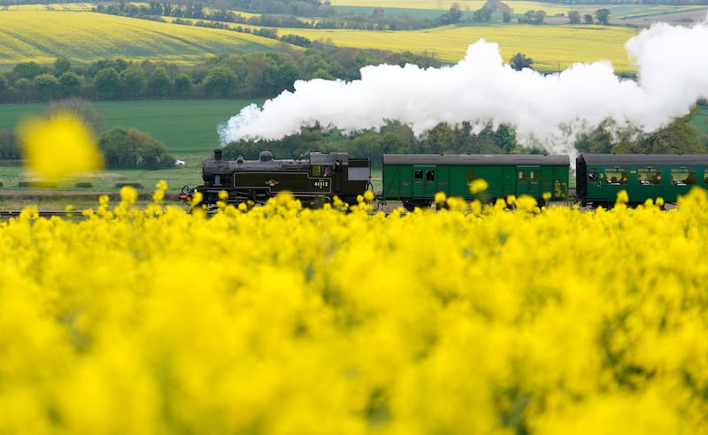 A British Railways Ivatt Class 2MT engine travels along the Mid Hants Railway, also known as the Watercress Line, in Hampshire, southern England, at the Spring Steam Gala. PA