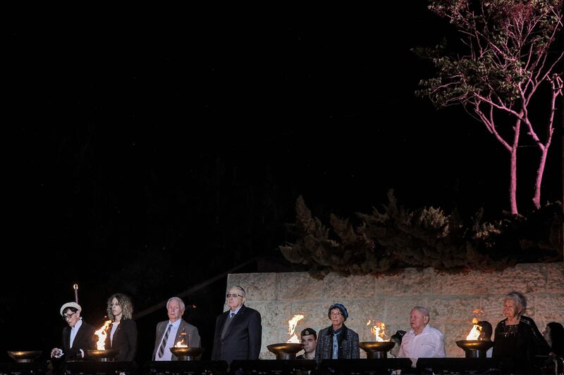 Holocaust survivors light six torches in memory of the six million Jews killed by Nazi Germany during the Second World War. AFP