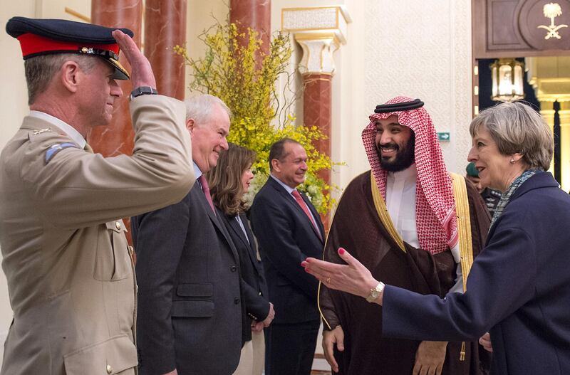 A handout picture provided by the Saudi Royal Palace on April 4, 2017 shows Saudi Deputy Crown Prince Mohammed bin Salman (2nd L), the kingdom's defence minister, and British Prime Minister Theresa May (R) greeting officials in the capital Riyadh. / AFP PHOTO / Saudi Royal Palace / BANDAR AL-JALOUD / RESTRICTED TO EDITORIAL USE - MANDATORY CREDIT "AFP PHOTO / SAUDI ROYAL PALACE / BANDAR AL-JALOUD" - NO MARKETING - NO ADVERTISING CAMPAIGNS - DISTRIBUTED AS A SERVICE TO CLIENTS