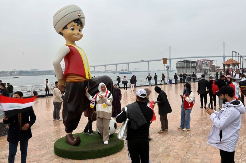 Tourists in Basra take photos with Sinbad the Sailor, chosen as this year's Gulf Cup mascot. Reuters