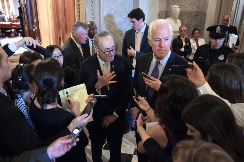 Democratic senator Charles "Chuck" Schumer (centre-left) and Republican senator John Cornyn (centre-right), the co-authors of the Jasta bill, speak to reporters following the Senate override vote on September 28, 2016. Shawn Thew/EPA