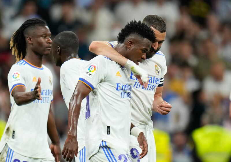 Real Madrid's Rodrygo celebrates with teammates after scoring his side's third goal. AP